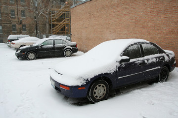 Cars covered by heavy snow