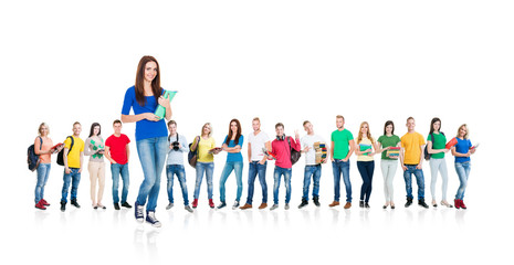 Obraz premium Large group of teenage students isolated on white background. Many different people standing together. School, education, college, university concept.