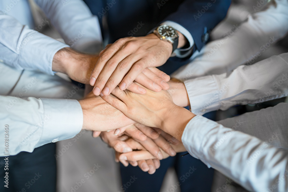 Fototapete Stack of hands. Unity and teamwork concept.