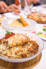Curry rice with pork burger on top