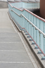 empty pedestrian walkway with bannister