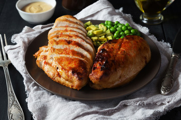 Fried chicken fillet on brown plate