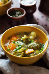 Vegetable soup with green peas and broccoli