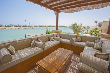 Terrace balcony with chairs in tropical luxury apartment