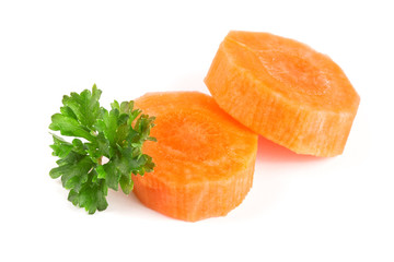 Chopped carrot slices and parsley herb leaves isolated on white background