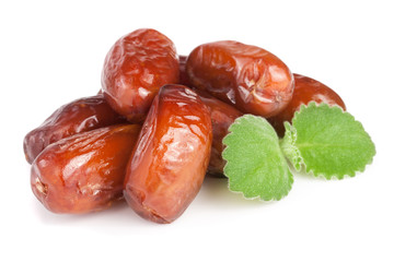 Dates with mint leaves isolated on white background