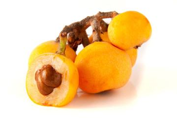 Ripe loquat or Eriobotrya japonica with leaf isolated on white background