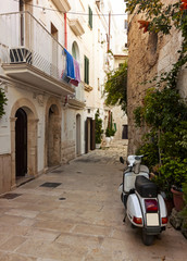 Old scooter on street in Italy