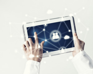 Close of female doctor hands working with tablet pc computer