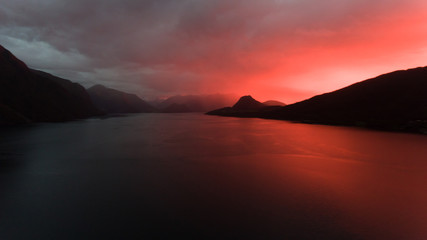 Dramatic sunset over Norwegian fjord - Aerial drone shot