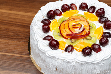 White cake with cream and fruits