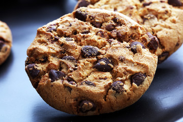 Chocolate cookies on wooden table. Chocolate chip cookies shot