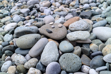 Fototapeta na wymiar the sun of pebbles on the beach
