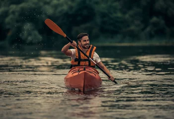 Foto op Canvas Man and kayak © georgerudy