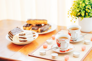 Cake and two cups of tea on the table. Beautiful composition. Breakfast.