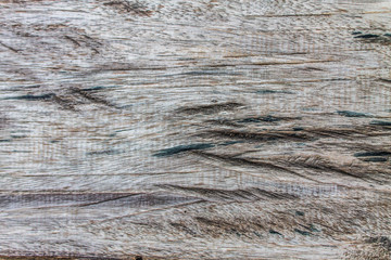 Older wood panels have cracked surface is not smooth.