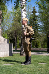 Fighter of Red Army in the form of times of World War II at a historical monument  on Mamayev Kurgan