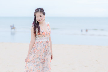 Fototapeta na wymiar Portrait Beautiful woman thailand posing on the beach