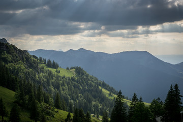 Naklejka na ściany i meble Beautiful landscape in bavaria, green hills with clouds. 