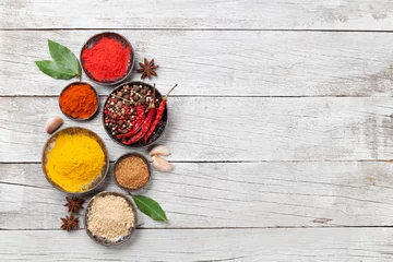 Zelfklevend Fotobehang Diverse specerijen en kruiden © karandaev