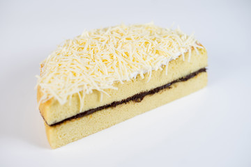 cheese cake whole with chocolate filling on a white plate