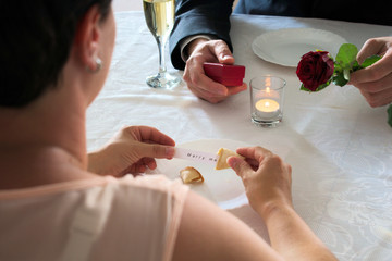 Marriage application at dinner with a fortune cookie