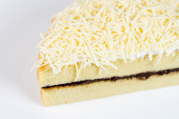 cheese cake whole with chocolate filling on a white plate