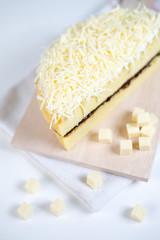 cheese cake whole with chocolate filling on a white plate