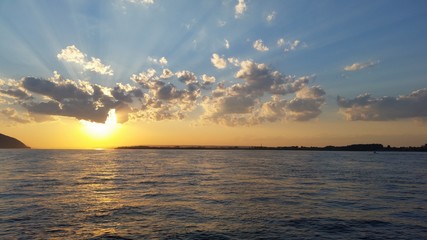Beautiful sunset sunset on a river with clouds