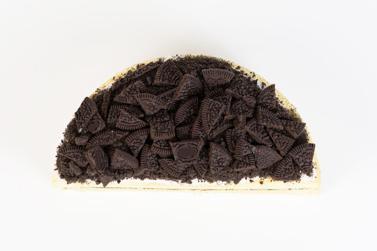 Chocolate cookies oreo cheese cake whole on white dish