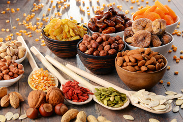 Composition with dried fruits and assorted nuts - obrazy, fototapety, plakaty