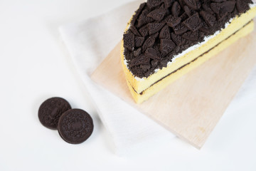 Chocolate cookies oreo cheese cake whole on white dish
