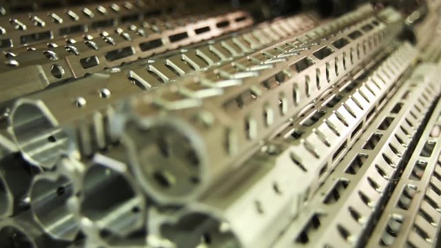 Long gun barrels in factory, close up