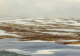 Colorful lonely Norwegian houses by the water