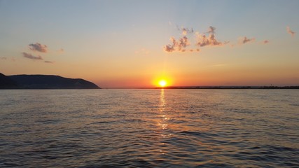 Beautiful sunset sunset on a river with clouds