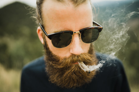 Young Man Smoking Joint