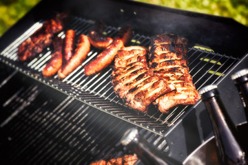 Meat cooking on barbecue grill for summer outdoor party