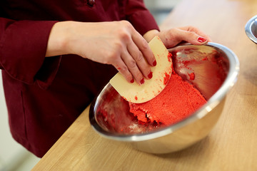 chef making macaron batter at confectionery