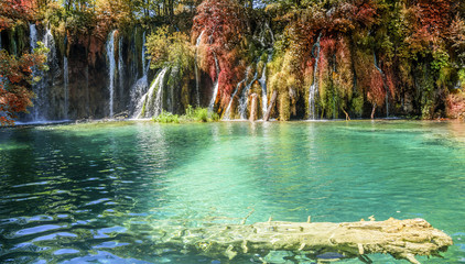 Waterfall in autumn forest at National Park Plitvice Lakes.