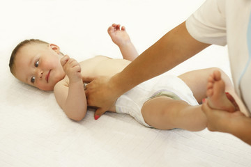 doctor doing massage feet baby