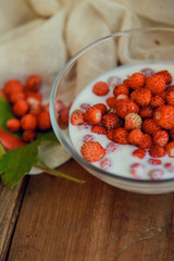 Dessert with fresh wild strawberries and cream.