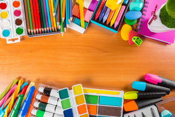 Desk cluttered with office supplies