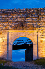 Cobblestone path, fortress gate, and a wooden bridge at twilight  inside Kalemegdan fortress in Belgrade, Serbia