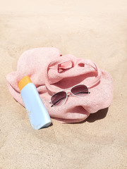 bag, sunblock,sunglasses on beach
