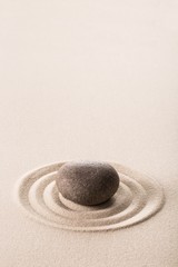 Fototapeta na wymiar Stone on sand.