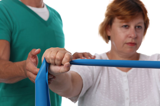 Senior woman having chiropractic back adjustment. Osteopathy, Alternative medicine, pain relief concept, Physiotherapy, injury rehabilitation treatment with Resistance Band.