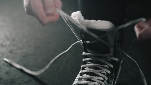Close-up of skates on player feet during ice hockey before game