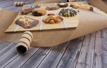 Dark vintage background with various homemade cookies.