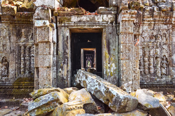 Fototapeta na wymiar Ancient temple stone wall and entrance ruins, Angkor Wat