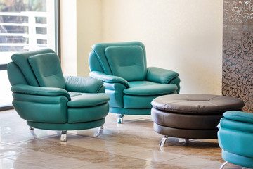 Comfortable modern luxury leather armchairs and round table